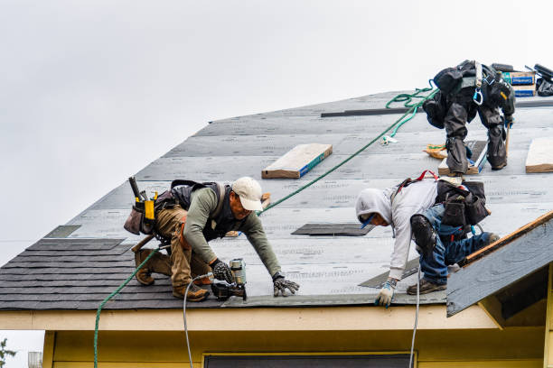 Professional Gutter Installation technician working in Henderson, IA